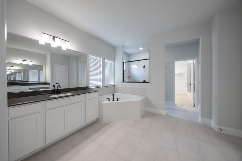spacious primary bathroom with double sinks