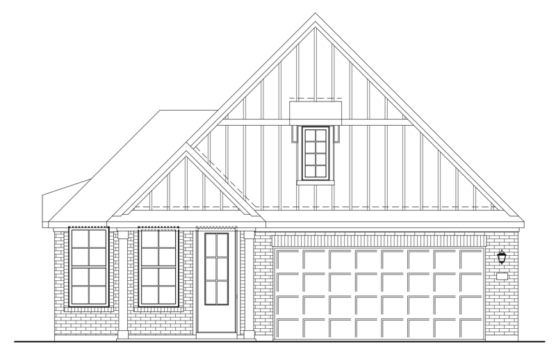 brick exterior with a garage & windows