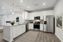 kitchen with white cabinets and pendant lighting