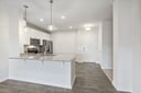 kitchen with pendant lighting and quarter countertops