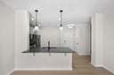 kitchen with quartz countertops and pendant lighting