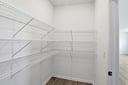 walk-in pantry with wire rack shelving
