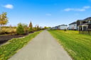concrete walking trail that goes around the community