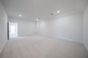 spacious media room with carpet and recessed lighting