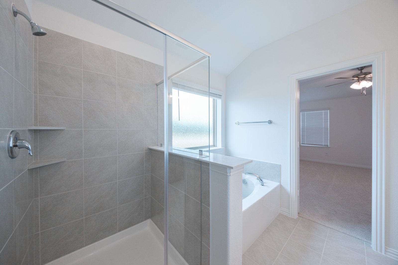 primary bathroom with soaking tub and walk-in shower