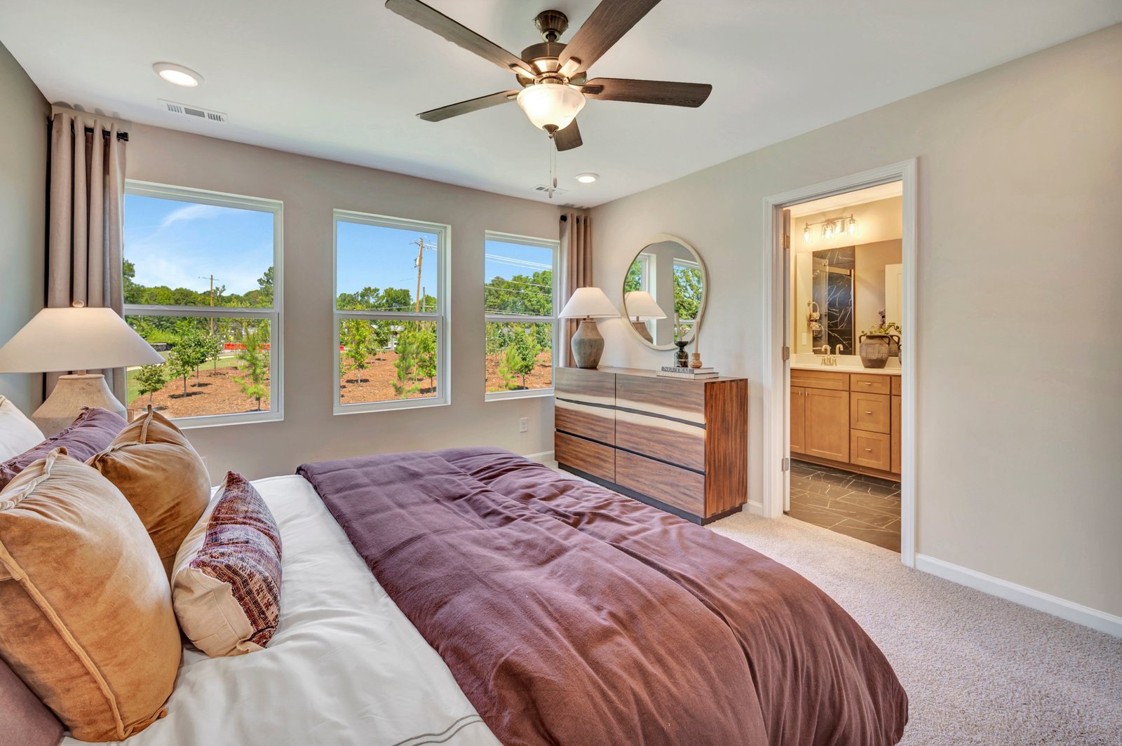 primary bedroom with three windows