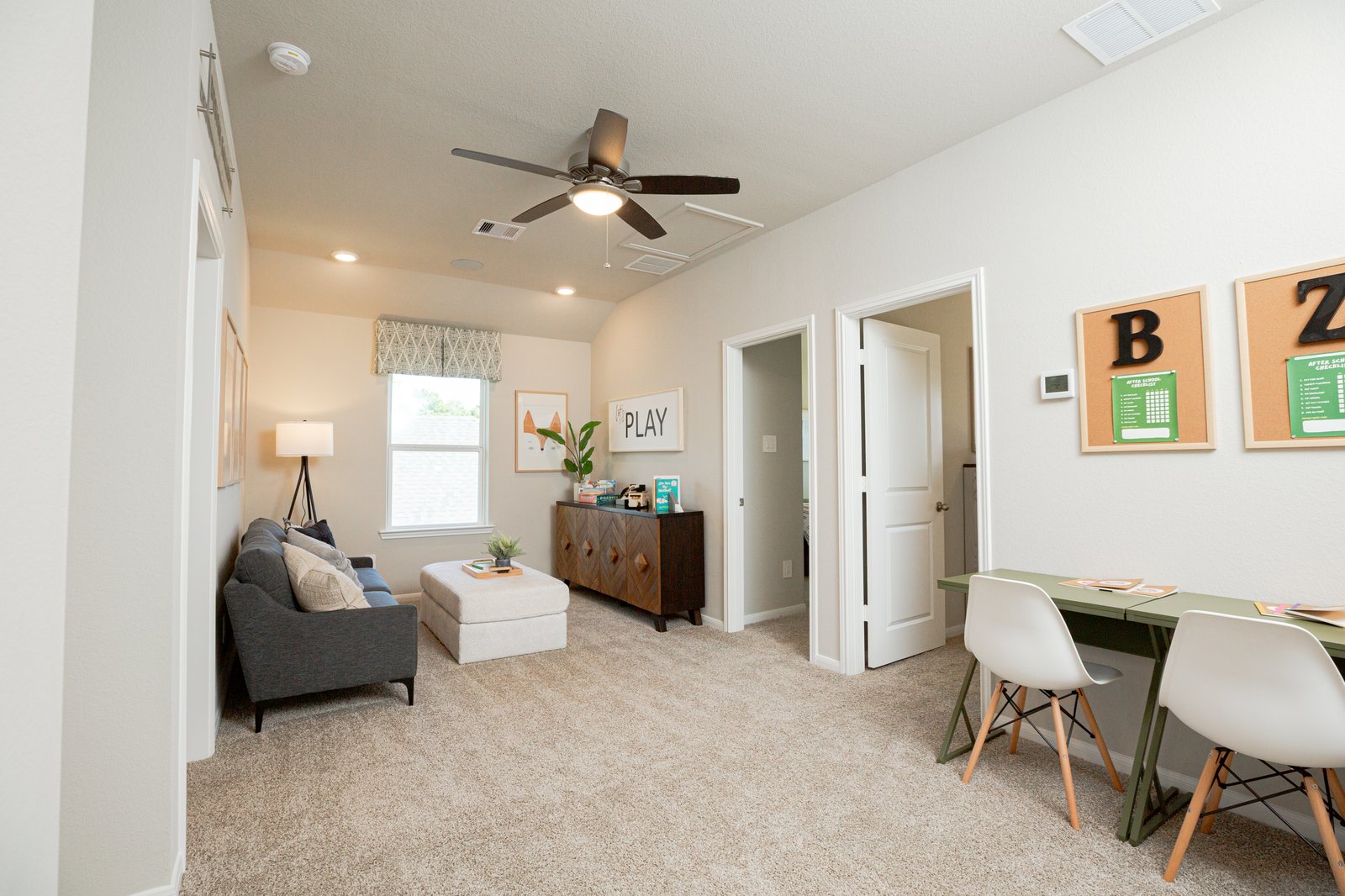 spacious loft with carpet and window