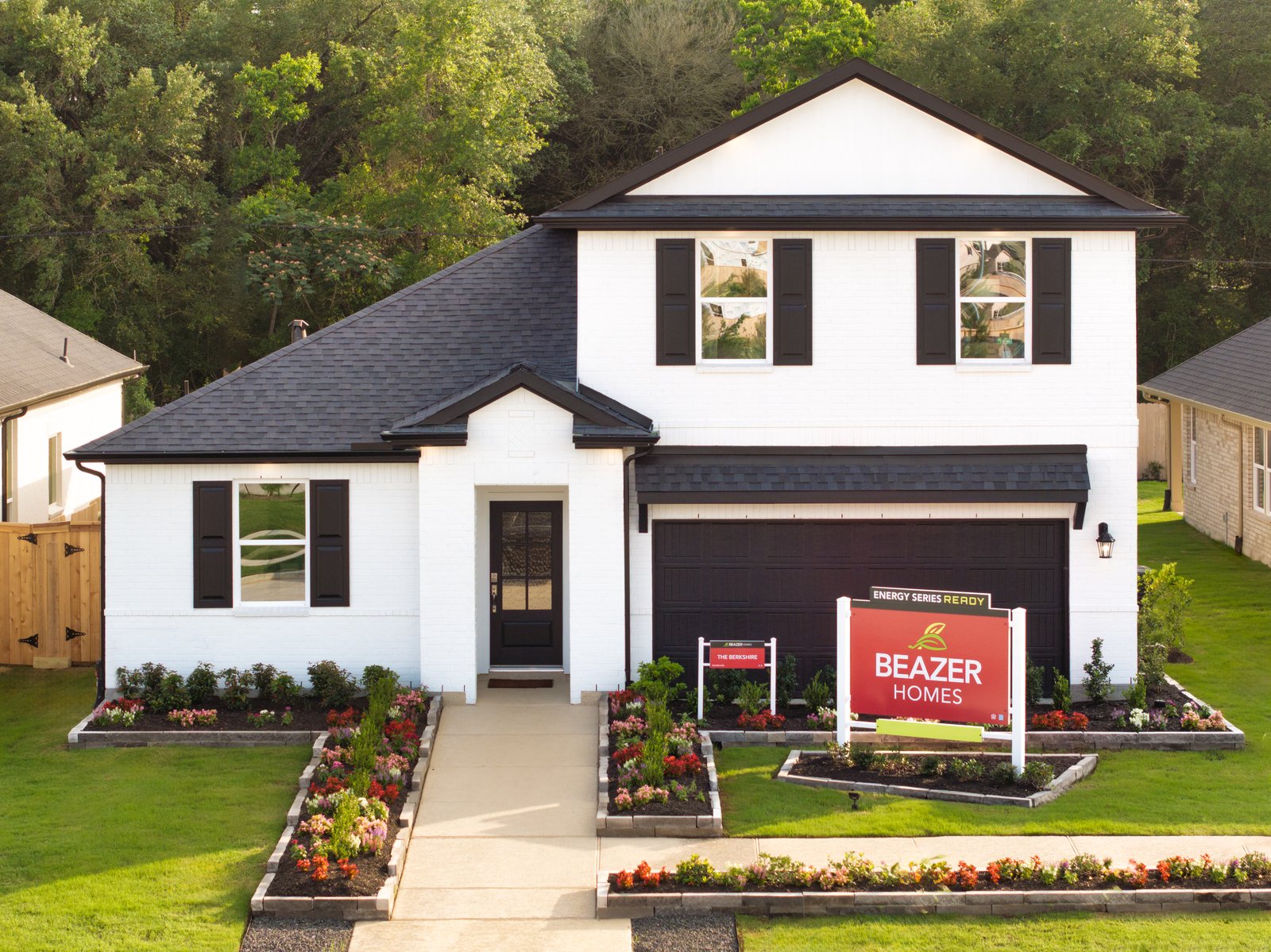 exterior of home with white brick and black siding