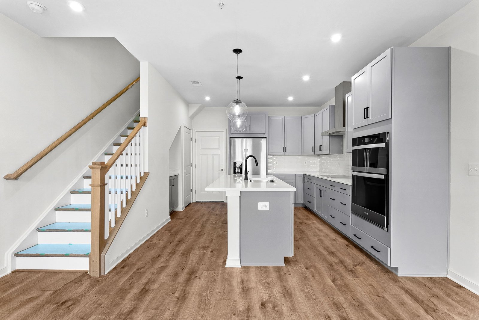 kitchen with an island with a sink