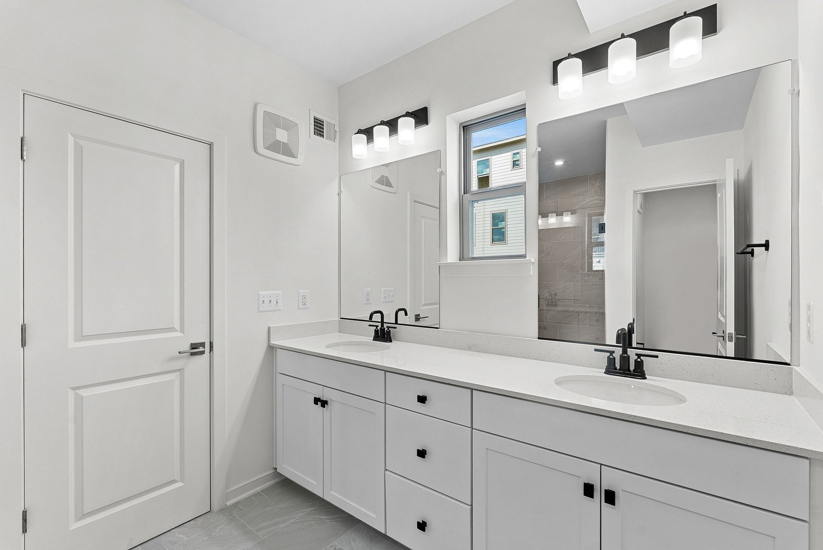 two large mirrors in the primary bath