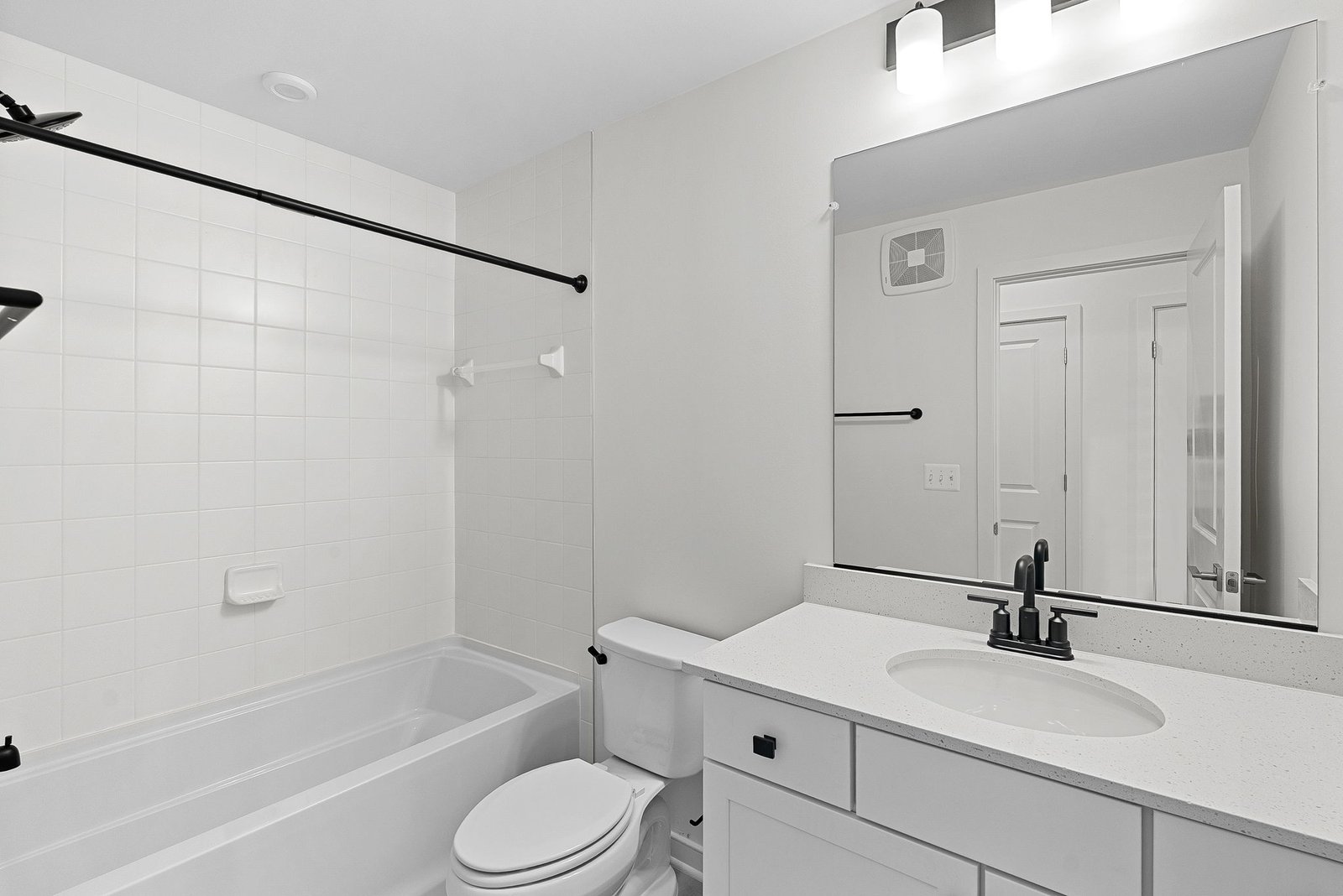 secondary bath with a shower and tub combination