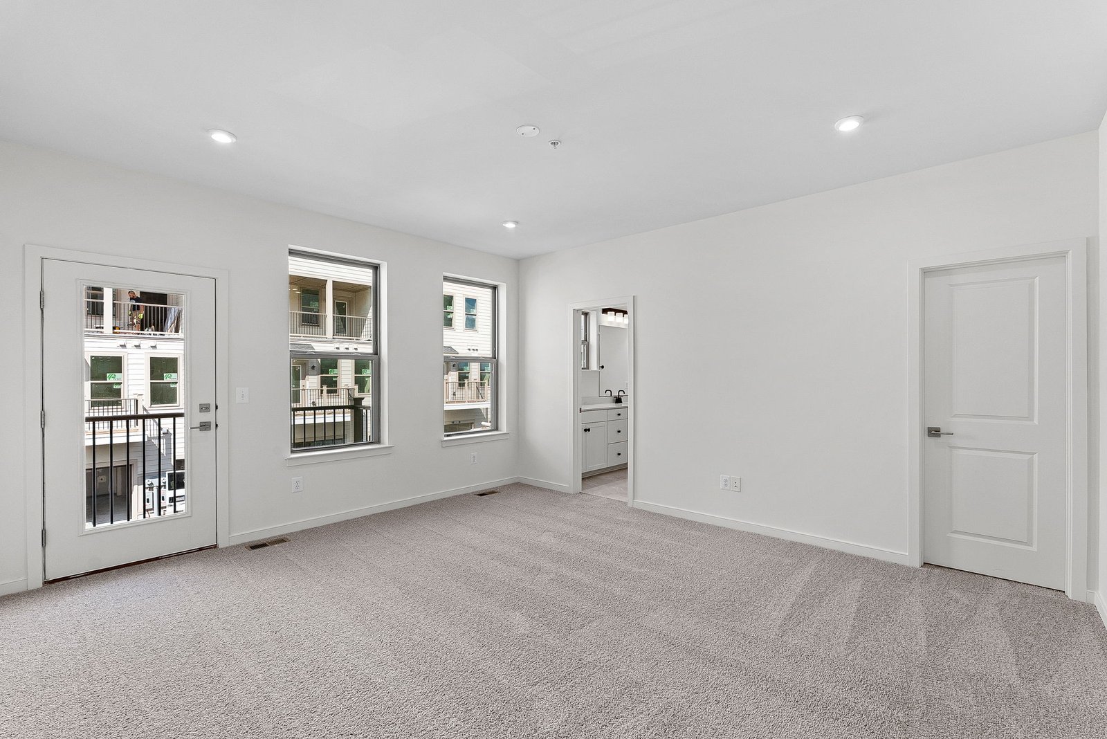 primary bedroom with a view of the deck