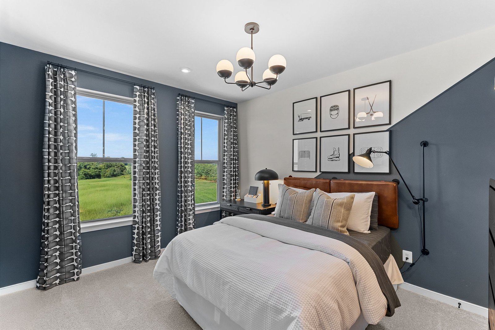 secondary bedroom with carpet and two windows