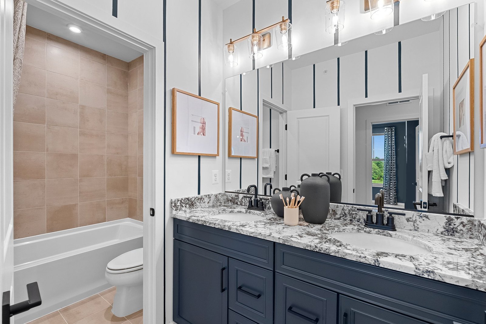 secondary bathroom with a shower and tub combo