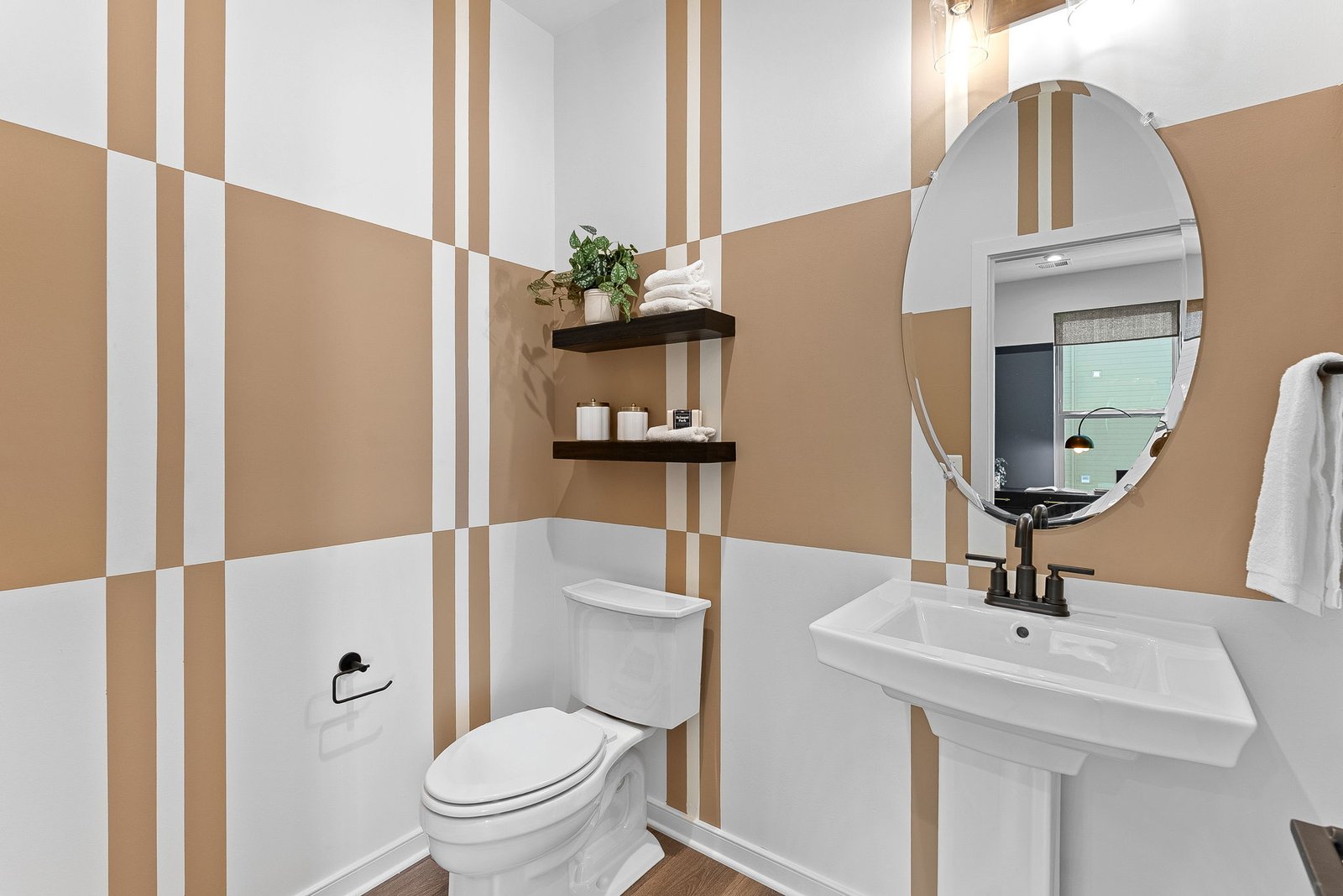 powder room with a pedestal sink and a mirror