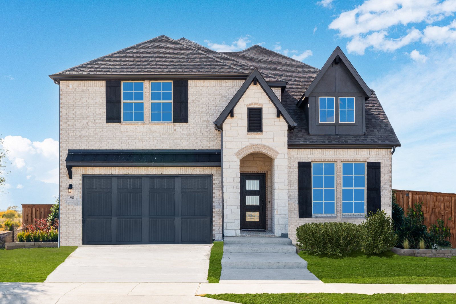 exterior of home with white brick and black siding