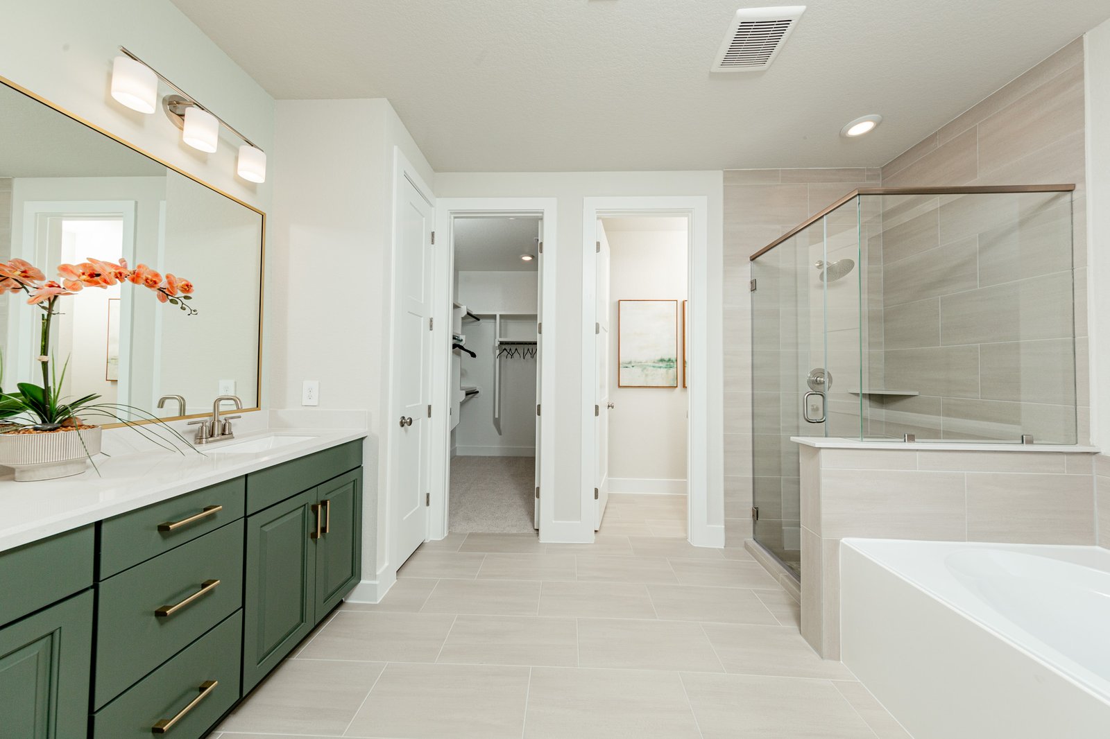 primary bathroom with tub and walk-in shower
