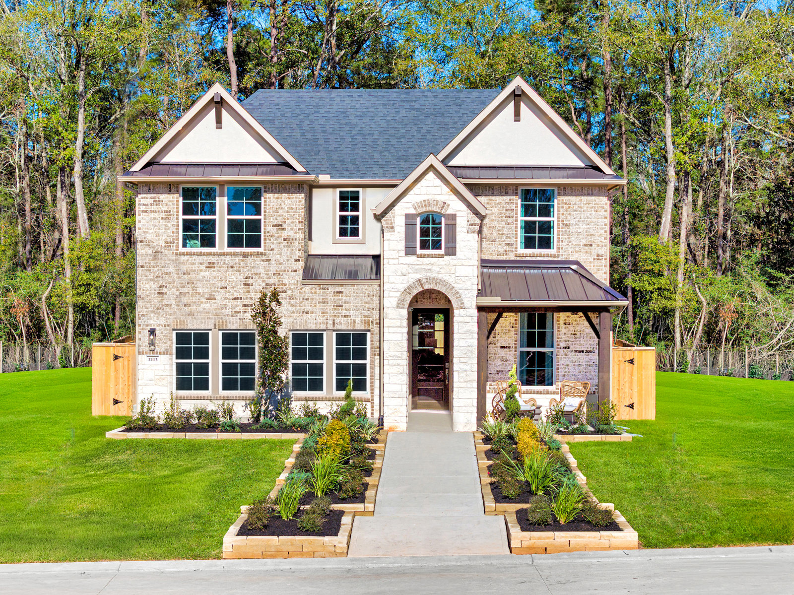 exterior of home with brown brick and white stone