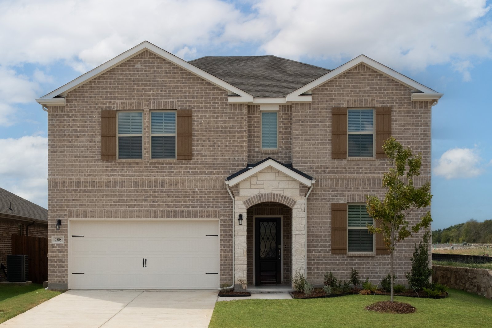 home exterior with brick and stone 