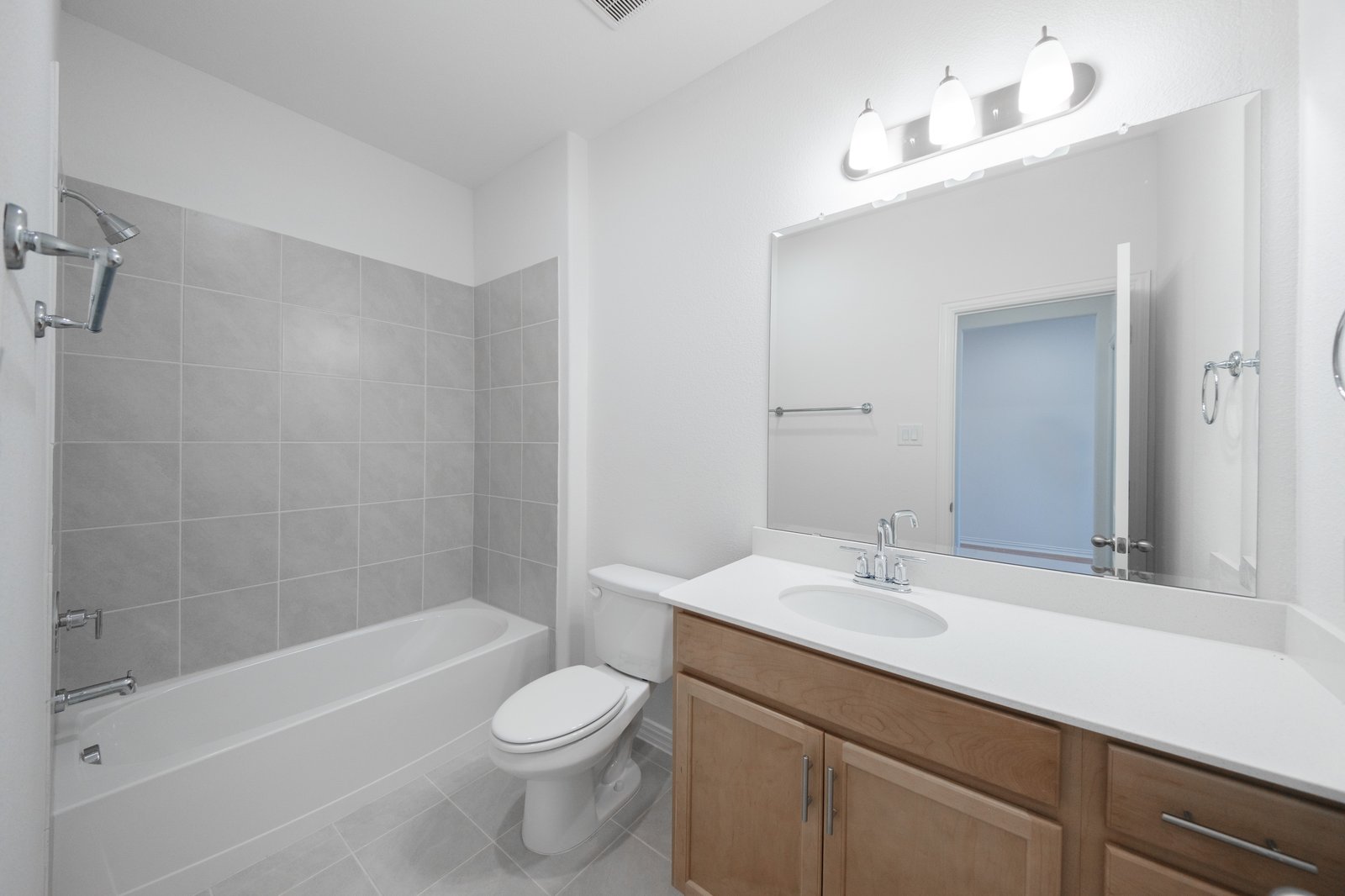bathroom with tub and tile 