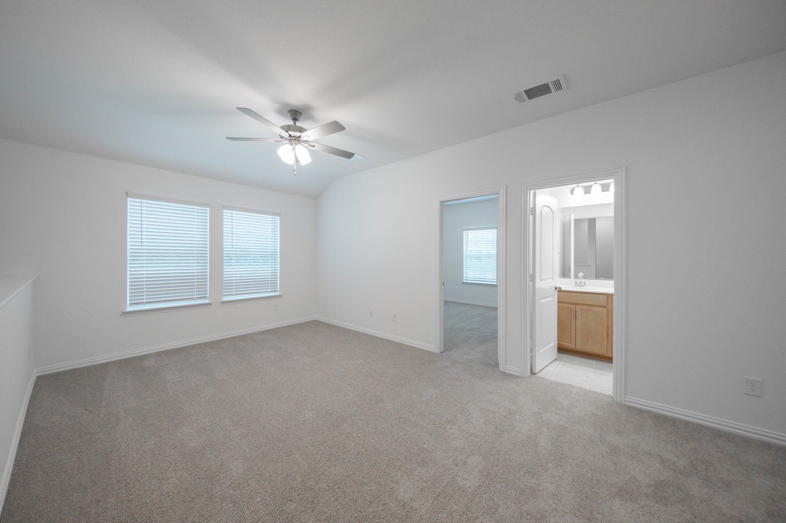 game room with windows and window blinds 