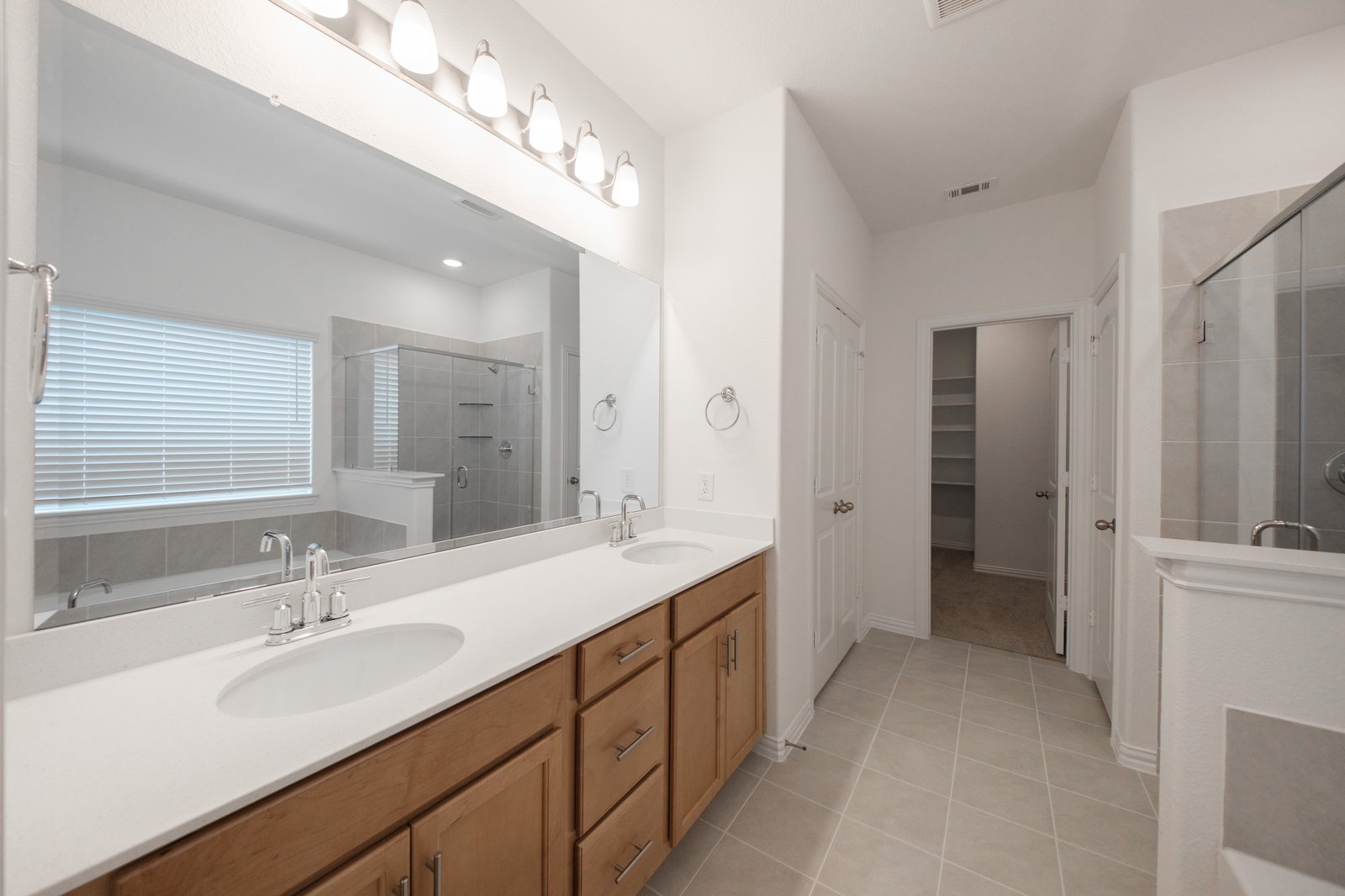 bathroom with two sinks and white countertops 