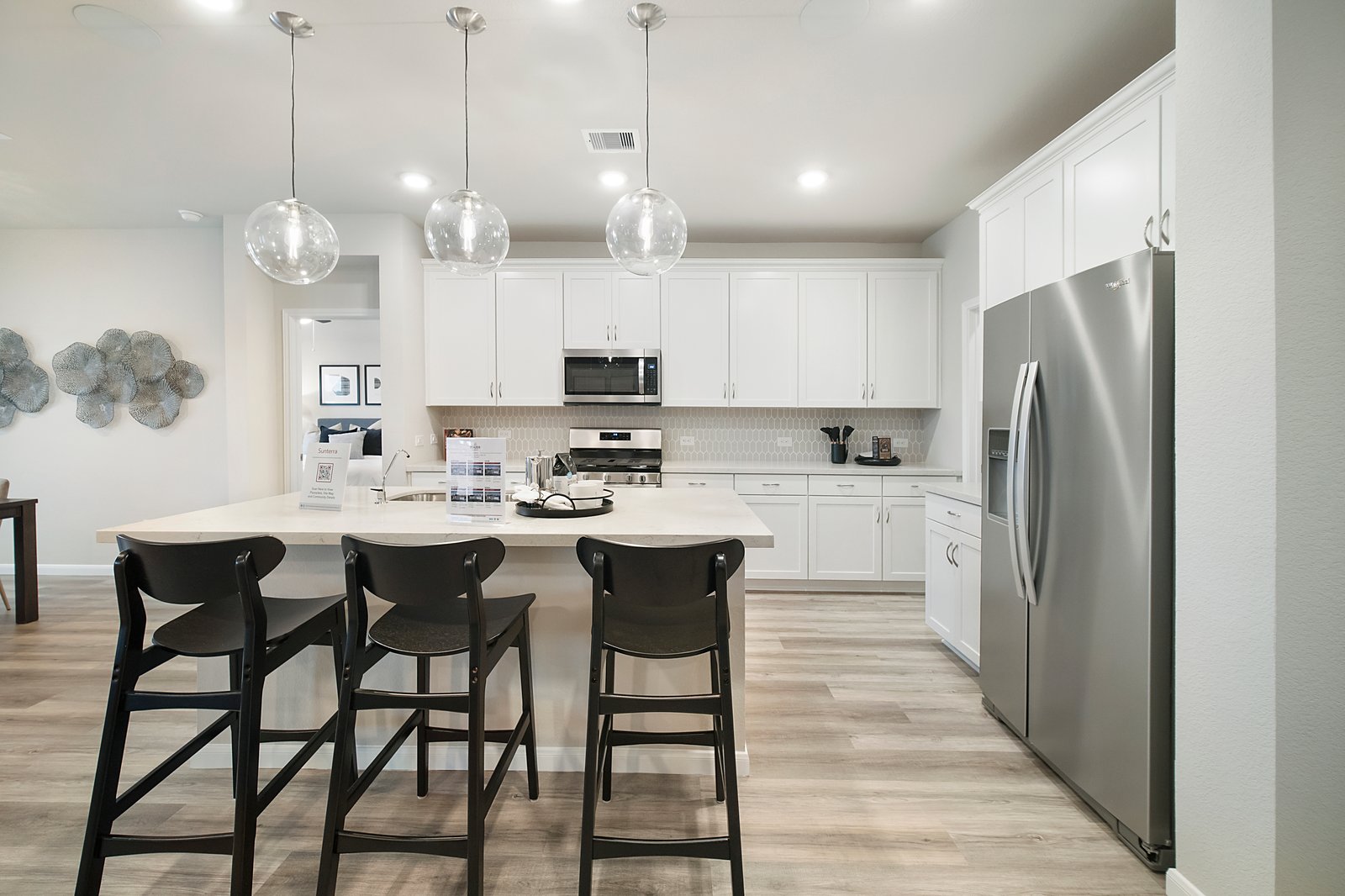 open kitchen with white cabinets