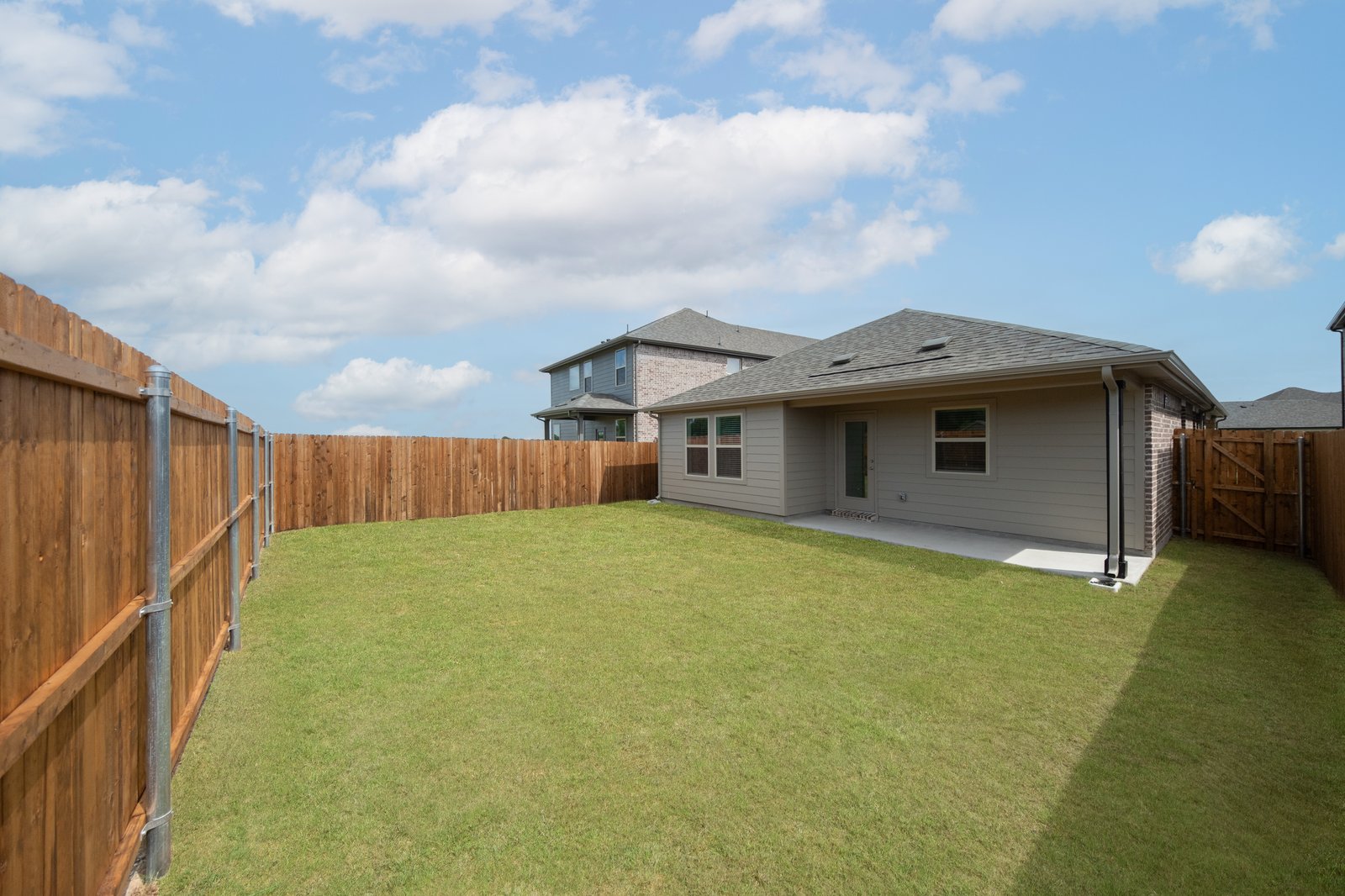 backyard with grass and covered patio