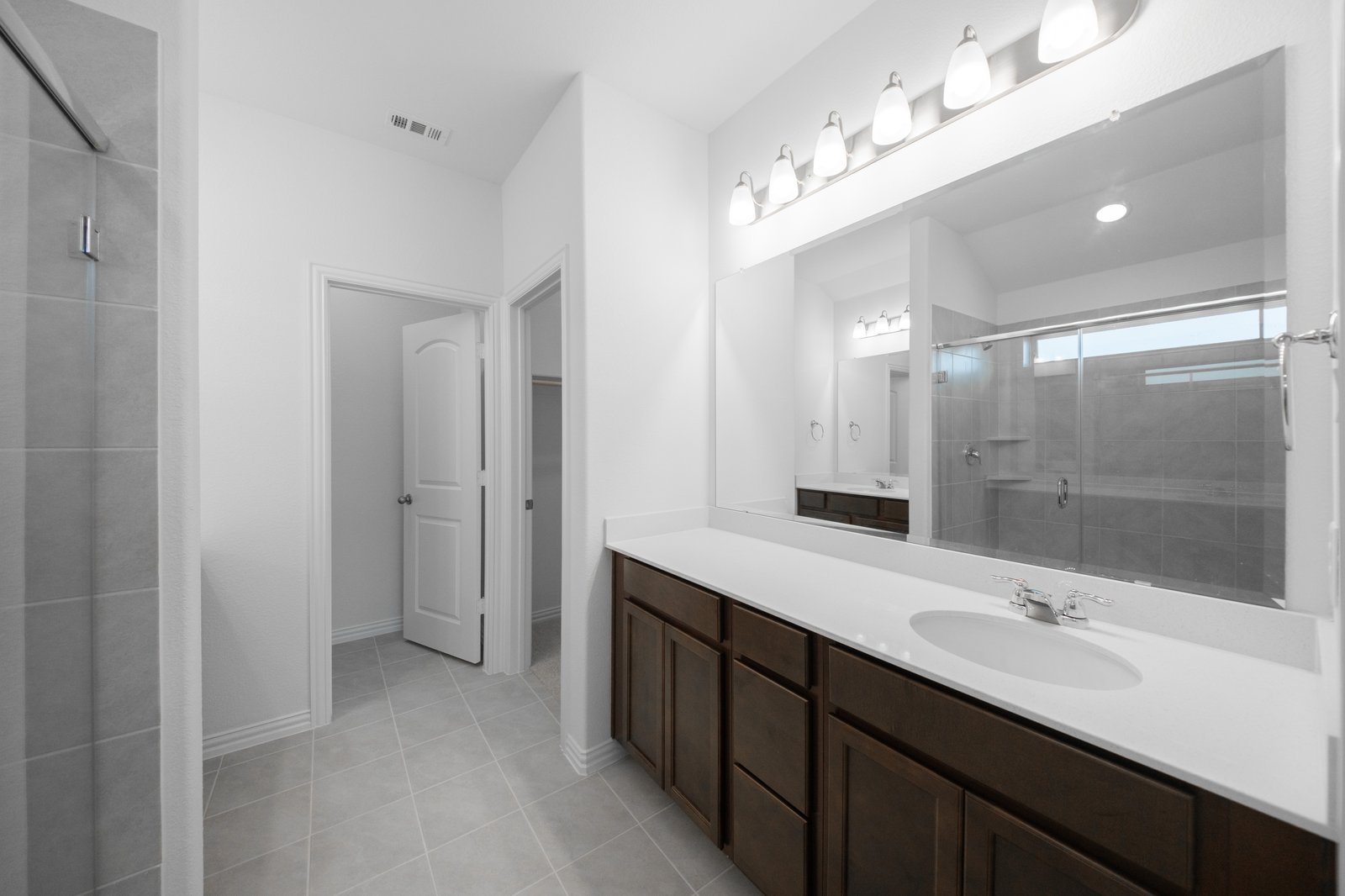 primary bathroom with soaking tub and walk-in shower