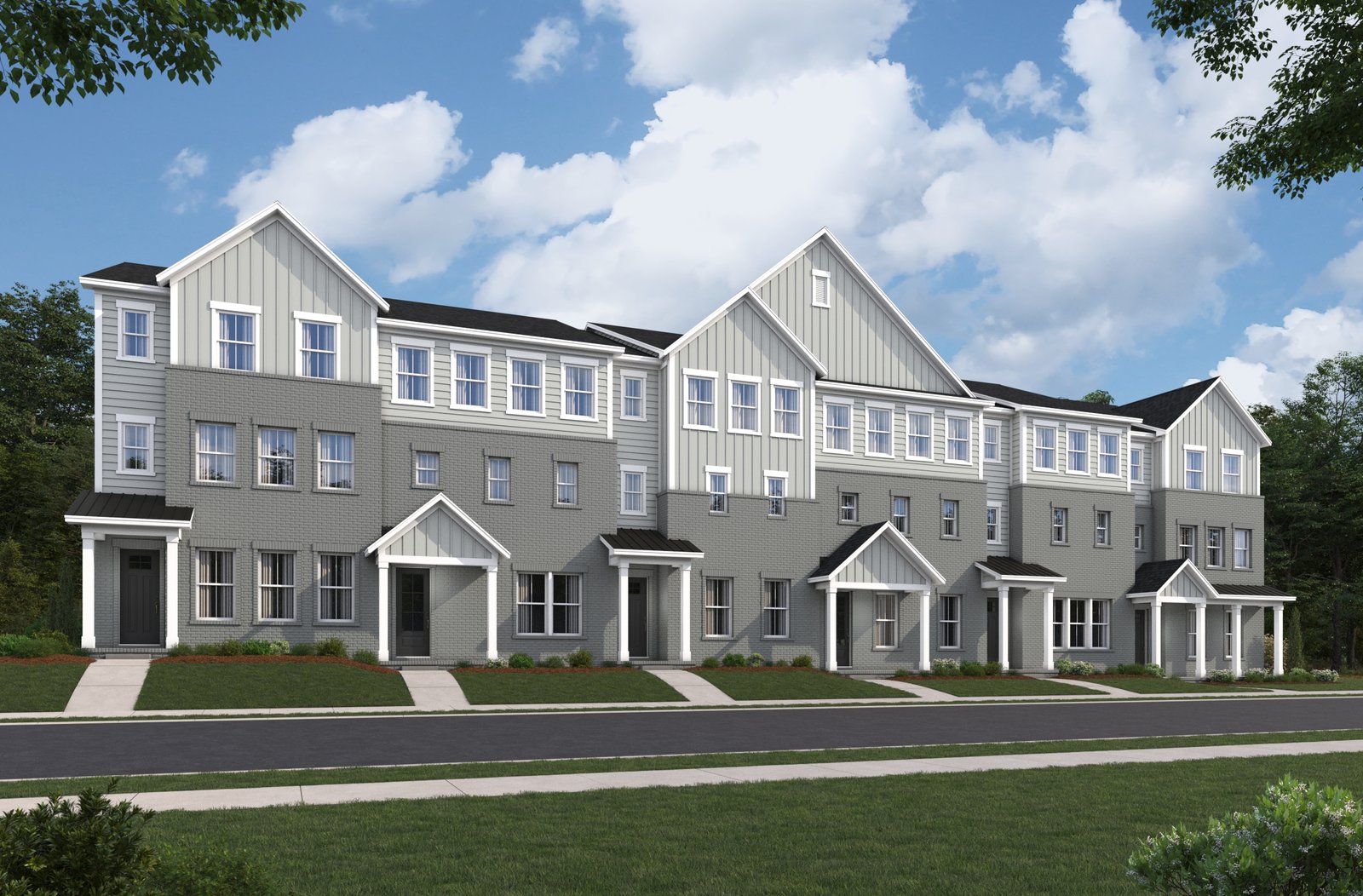 townhome exterior with brick and covered front porches