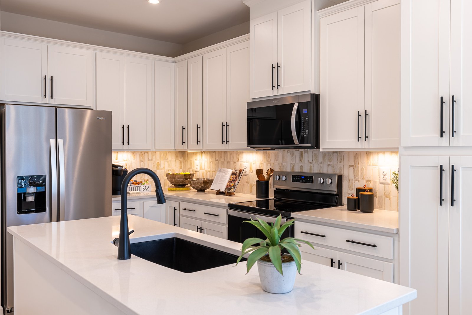 kitchen with white cabinets and countertops