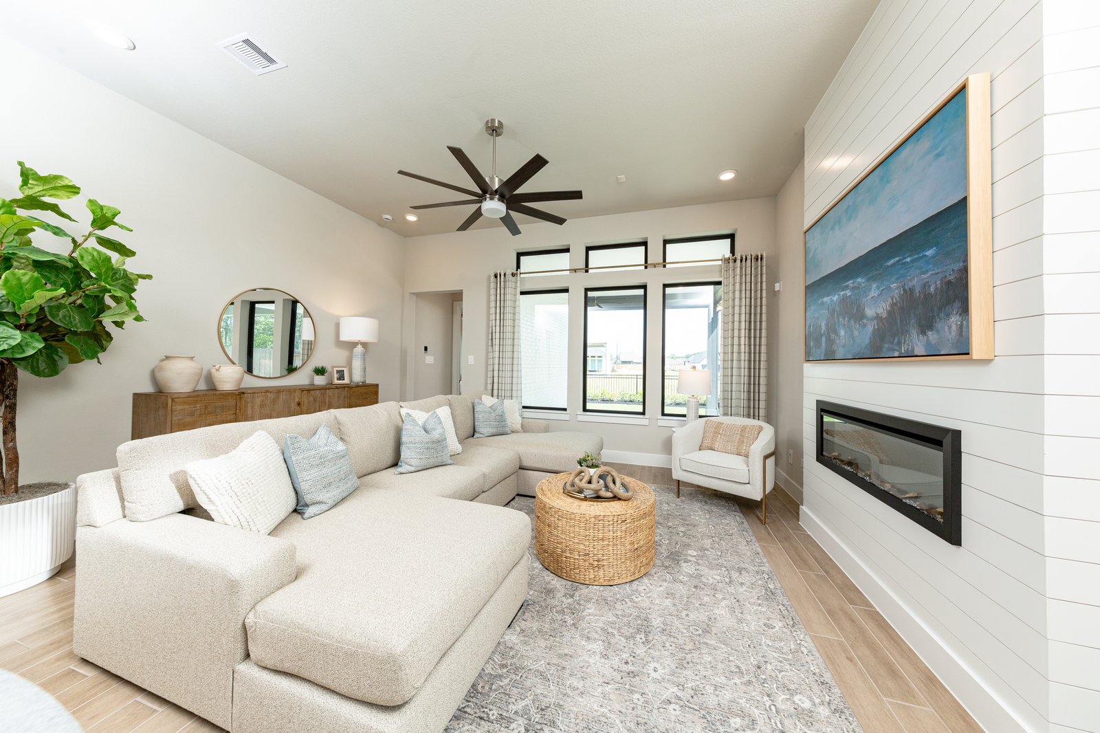 open great room with high ceilings and electric fireplace