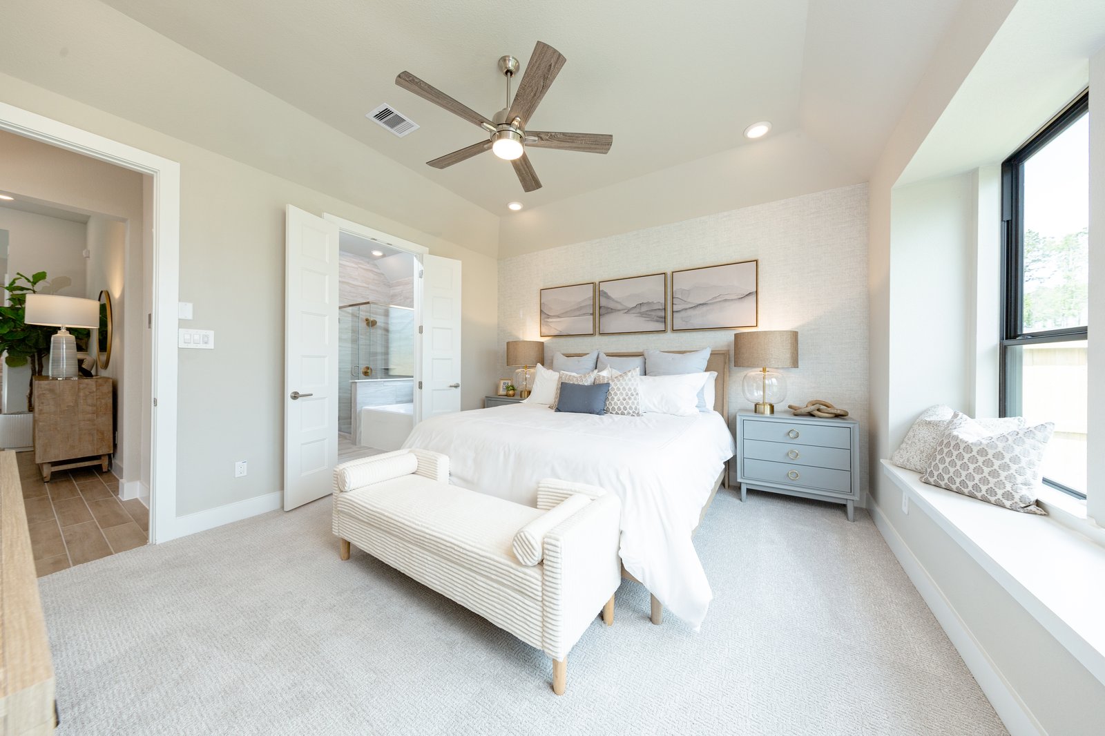 large primary bedroom with carpet