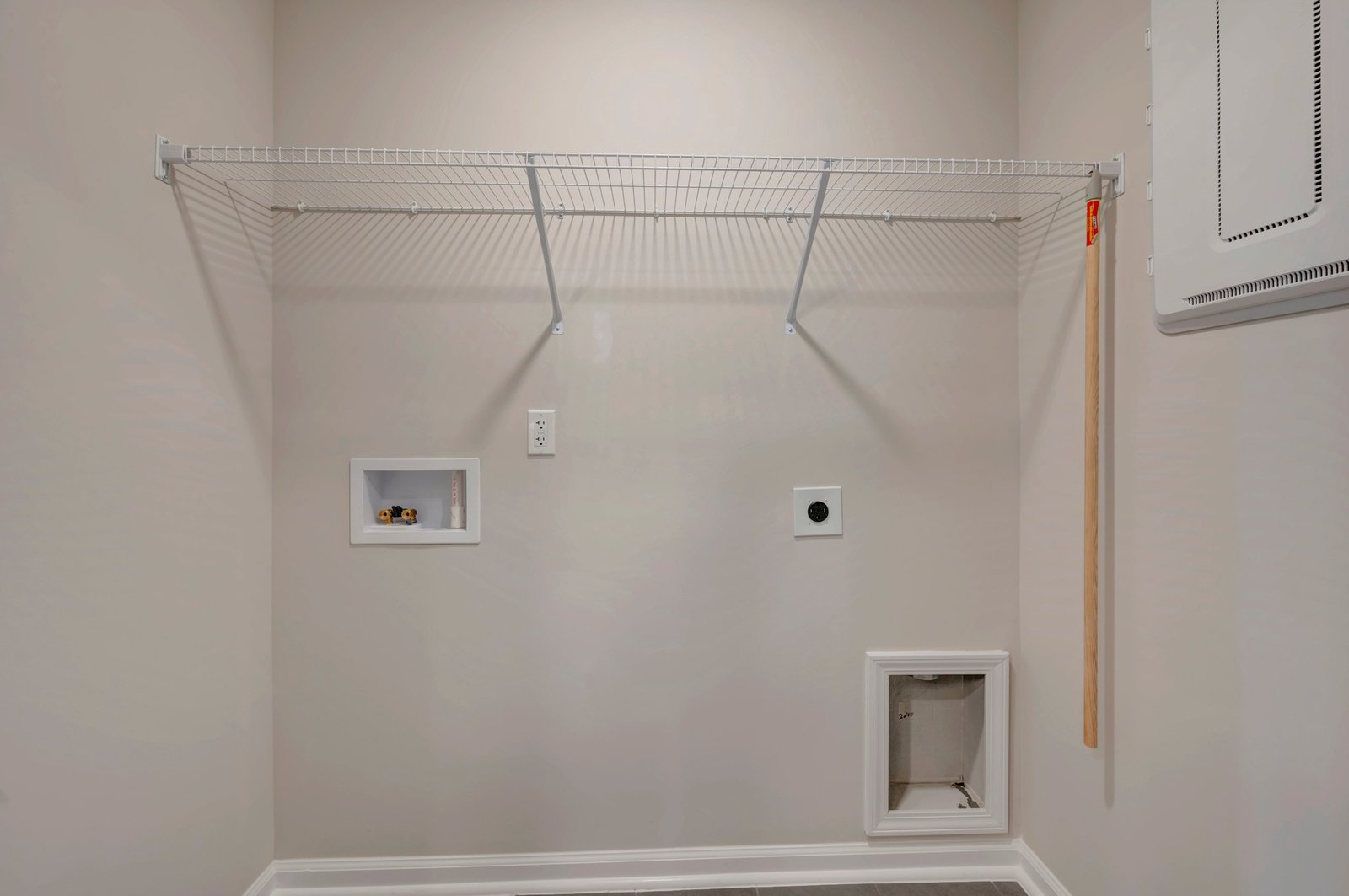 laundry area with a wire shelf