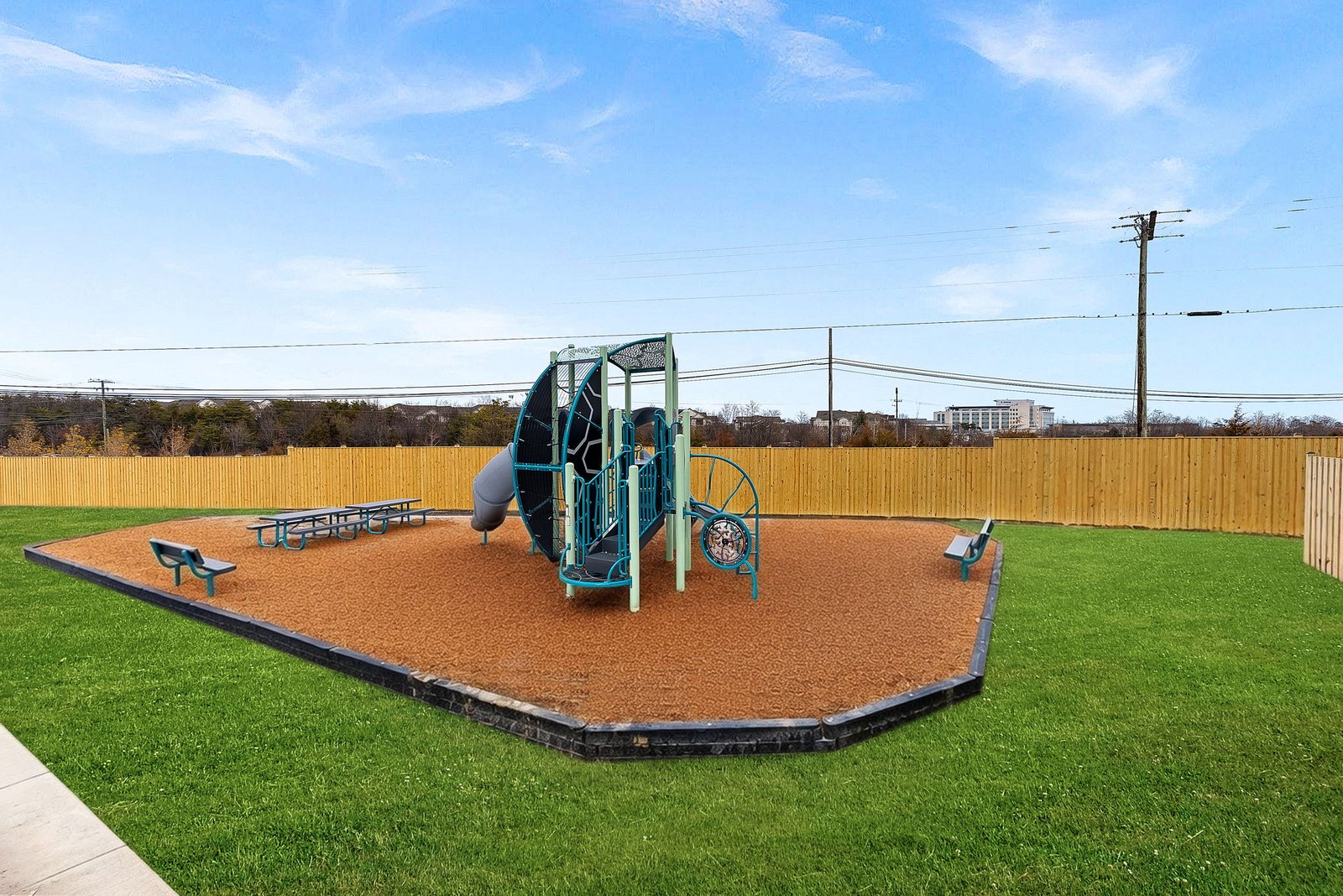 climbing structure and picnic tables