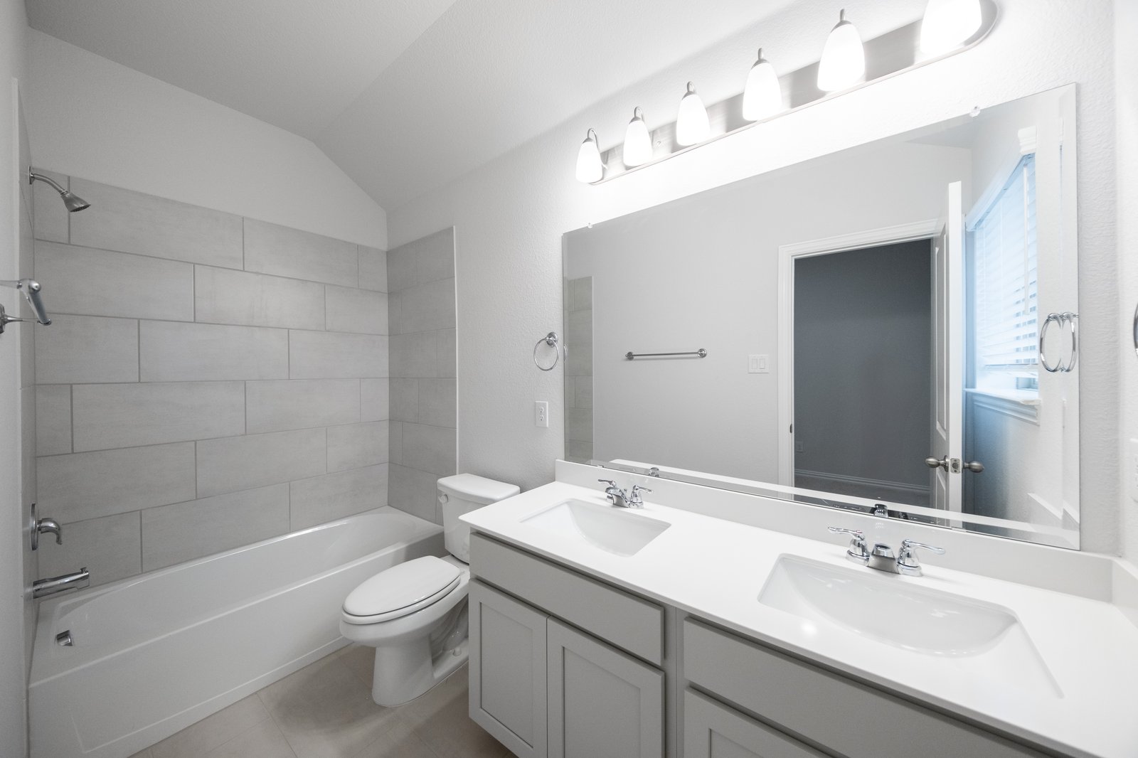 bathroom with tub and tile