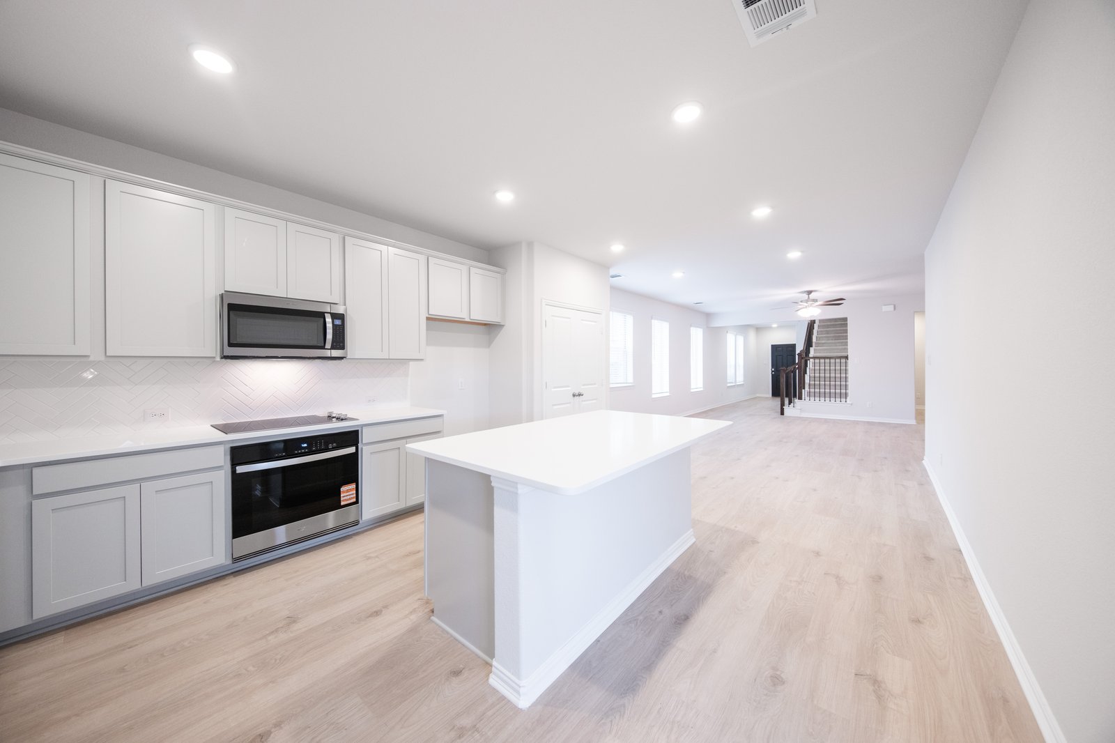 kitchen with large island and white countertops