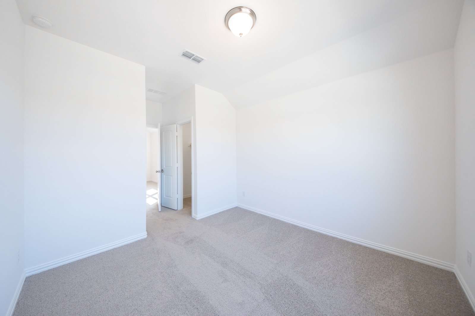 guest bedroom with carpet