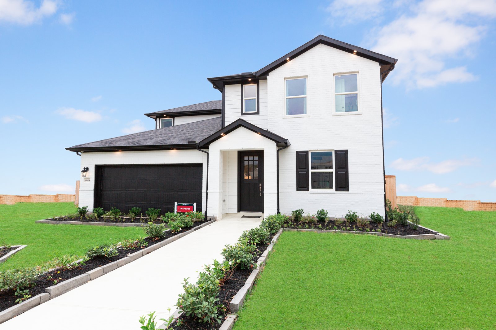 exterior of home with white brick and black siding