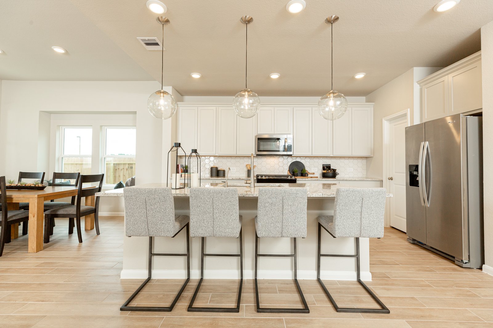 open kitchen with beige cabinets