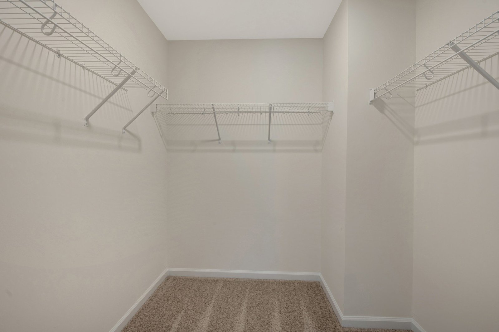 primary walk-in closet with wire shelves