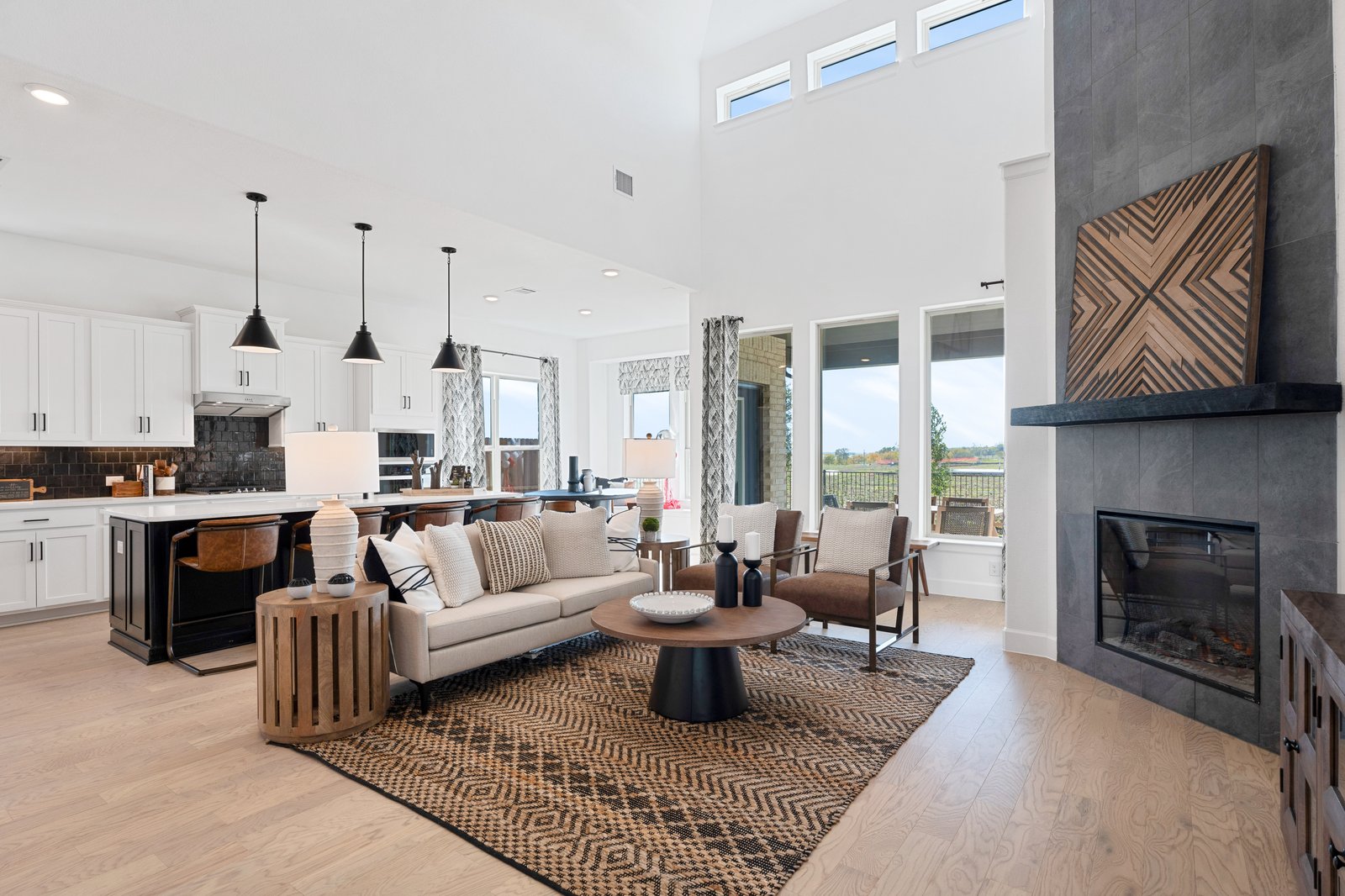 great room with high ceilings and wood flooring