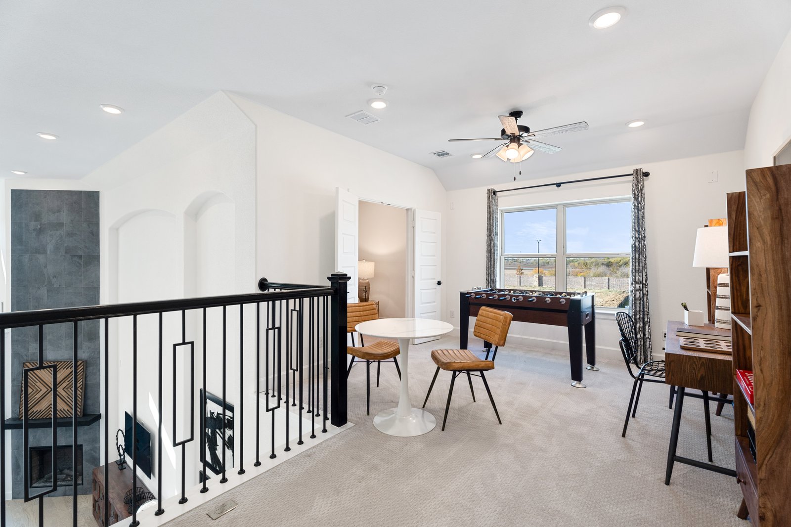 loft with carpet and large window