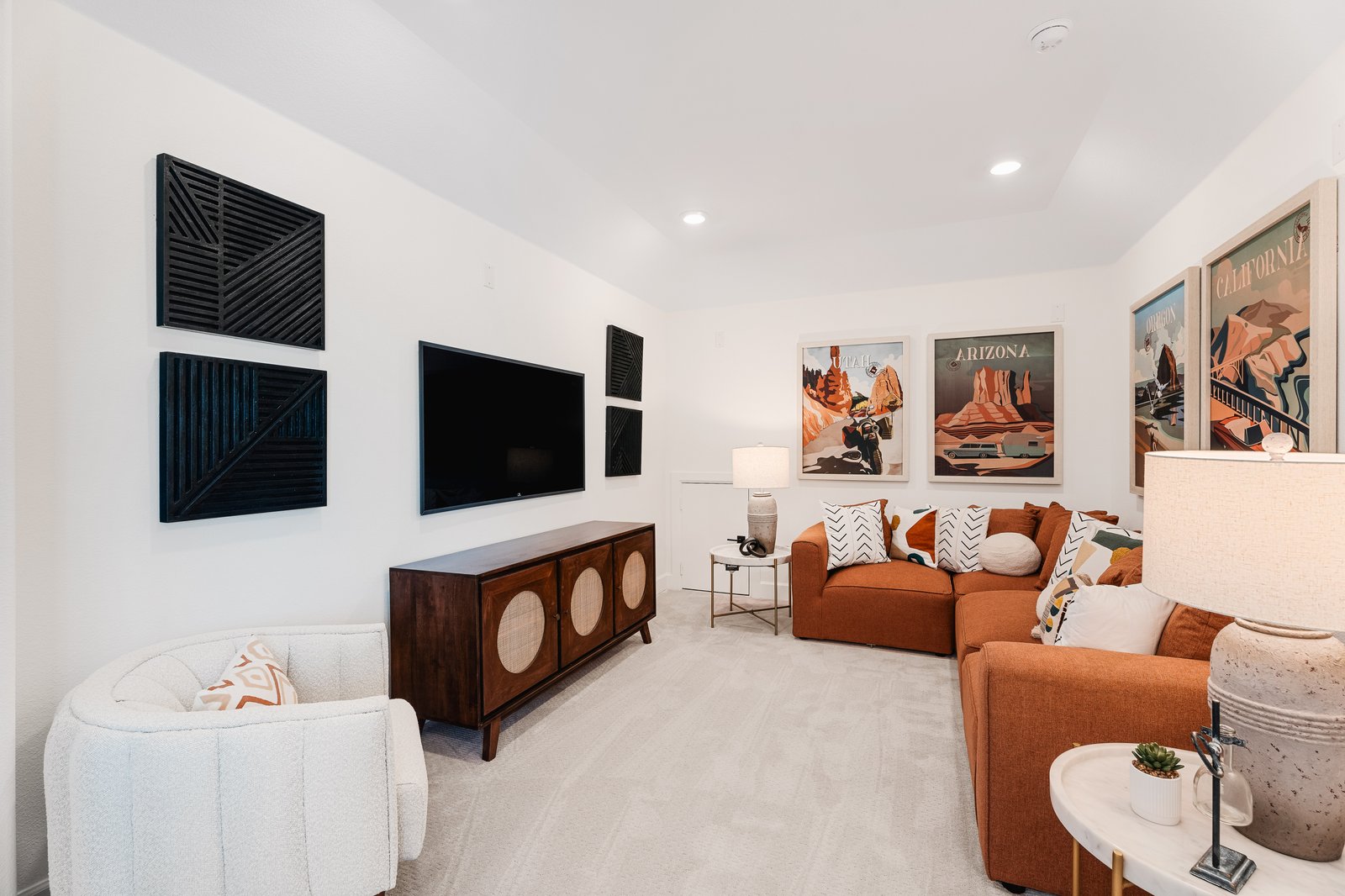 media room with couches and a v