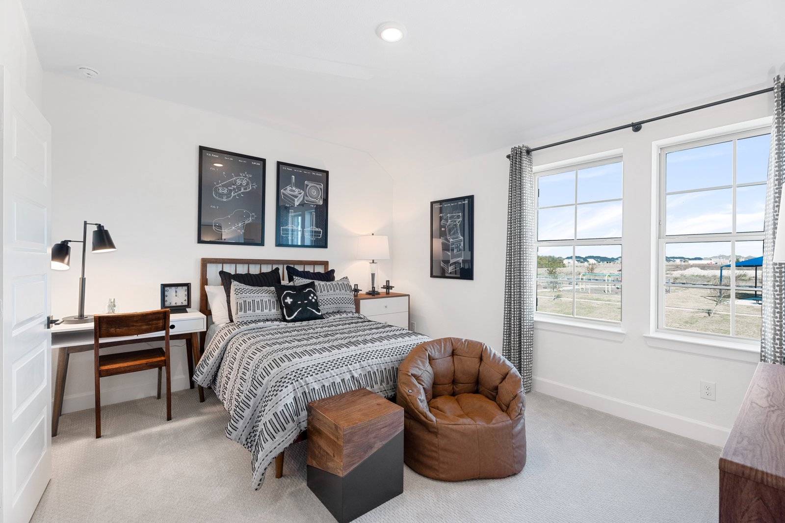 bedroom with carpet and windows