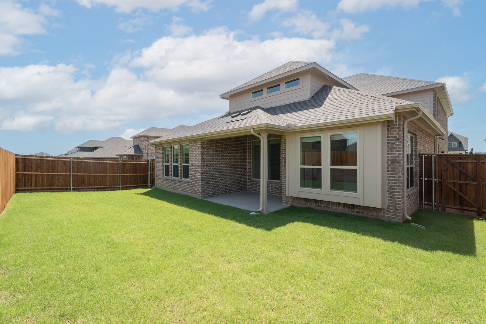 backyard with grass and covered patio