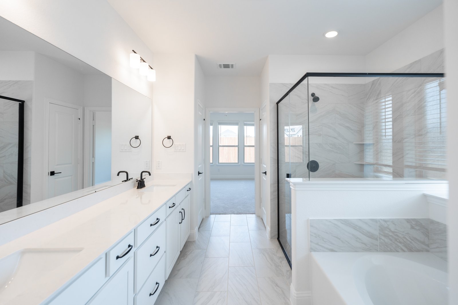 primary bathroom with soaking tub and walk-in shower