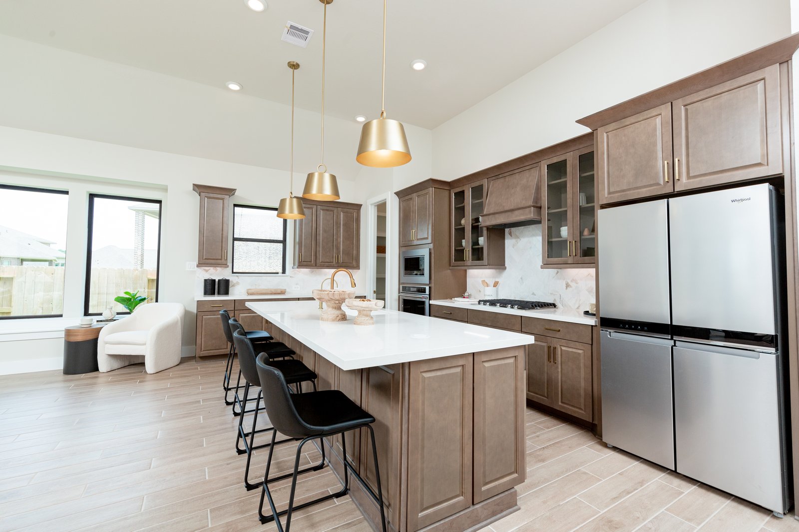 spacious kitchen with brown cabinets