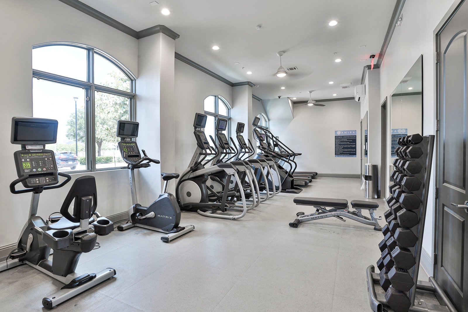fitness center with weights and cardio equipment