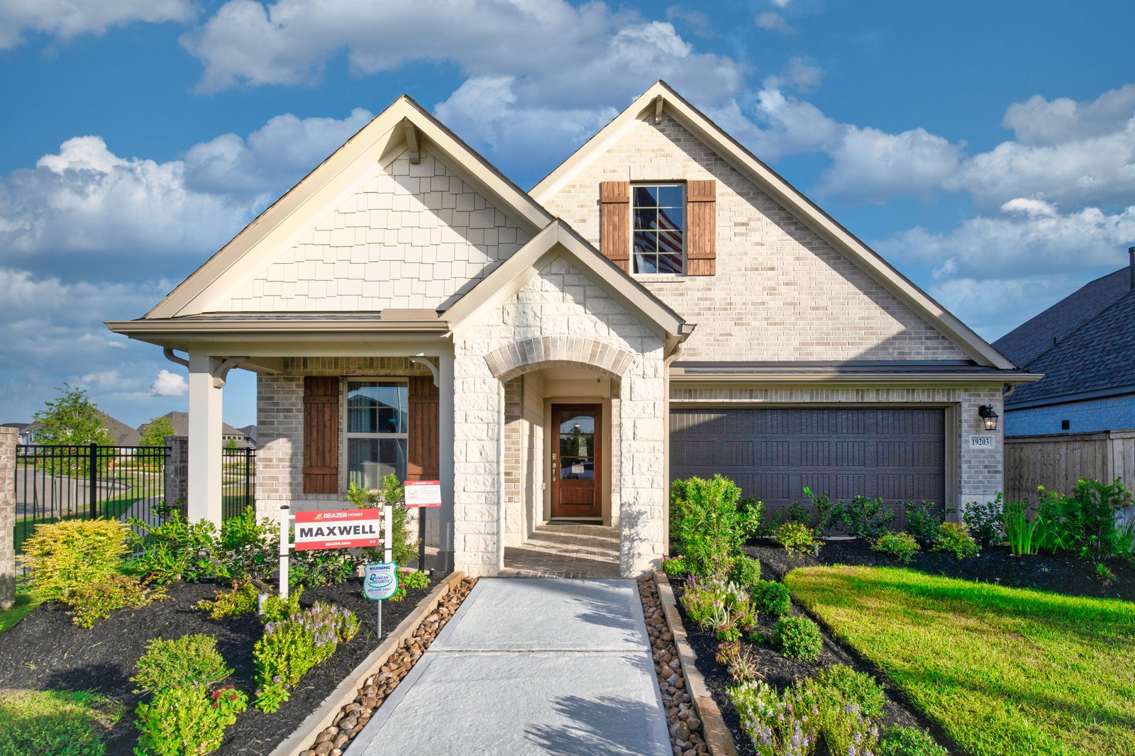 exterior of home with white brick and siding